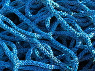 Close up of industrial blue construction rope thick and abstract