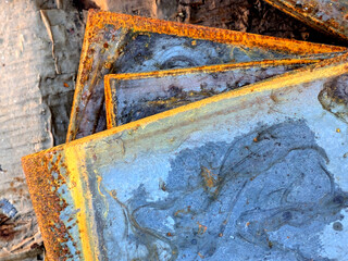 Close up of Heavily Rusted Blue Steel Metal Plate with Orange corrosion Close Up Background