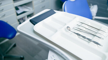 Close-Up of Stainless Steel Dental Tools on a Tray in a Modern Dentist Office