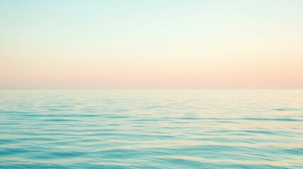 Obraz premium Tranquil Ocean Water with Soft Gradient Sky at Dawn or Dusk
