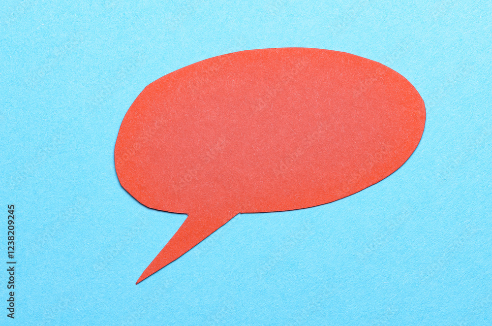 Aufkleber red cut out blank paper speech bubble of round shape with copy space for text on blue background, fl