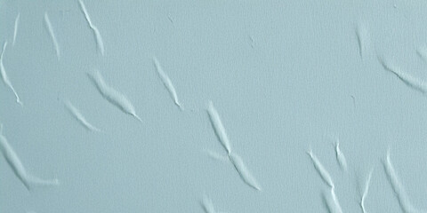 Old paper glued to a wall with wrinkles and crumples, abstract texture background