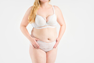 Obraz premium Fat woman in white underwear on gray background, overweight female, obesity body, weight loss concept