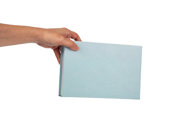 Blank blue book cover in hand on transparent background.