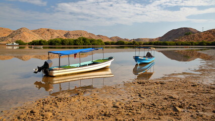 The Fjords of Bandar Al Khairan, located 30 km East from Muscat, Oman, with desert landscape, clear and colorful water, beaches and rocky mountains