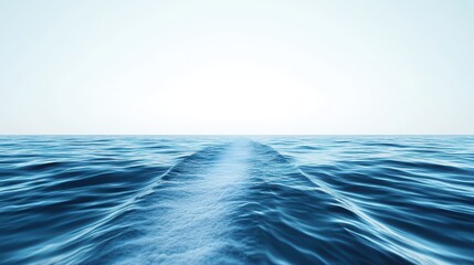 The yacht glides gracefully across the calm waters, leaving a gentle wake that forms a serene divide against the backdrop of a bright, clear sky, painting a tranquil scene on nature's blank canvas