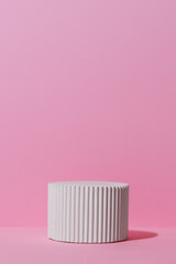 White podium on a pink background. Geometric premium scene for advertising and presentation your product. Showcase, display case.
