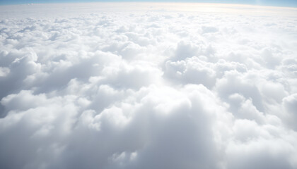 A breathtaking view of soft white clouds above, bathed in golden sunlight, creating a peaceful and dreamy atmosphere.







