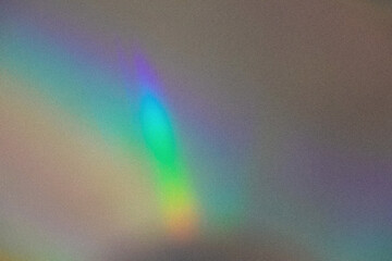 Blurred rainbow light refraction texture overlay effect for photo and mockups.