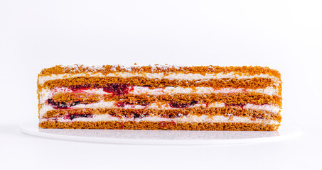 Delicious layered cake with cream and fruit filling, perfect for any celebration or dessert craving