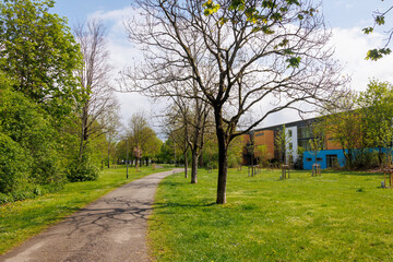 A path in a park with fruit trees and urban gardening in Königsbrunn near Augsburg in Bavaria on a...