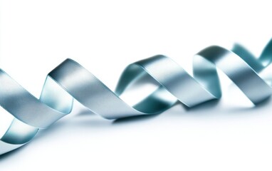 A delicate blue ribbon gracefully twisted, perfect for adding elegance to design projects, gifts, or decorations.