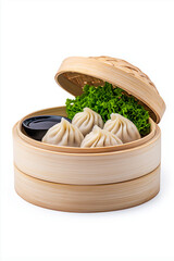 Floating steamed dumplings with dipping sauce, isolated on white background.