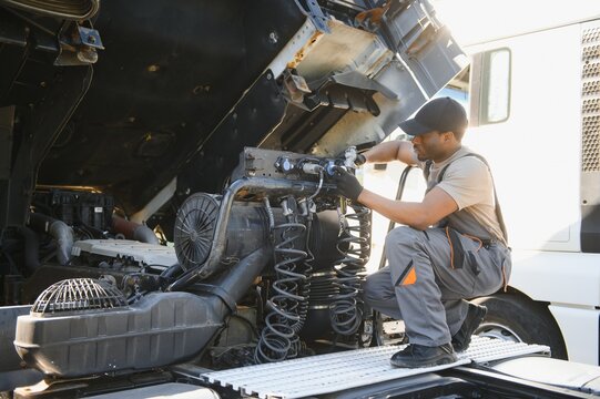 Professional truck mechanic working in vehicle repair service