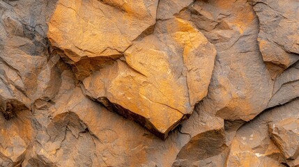 Fototapeta premium Textured rock wall with yellow mineral deposit, a closeup view of nature's intricate design