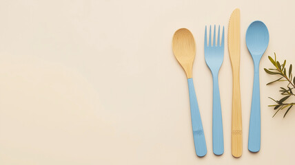 A blue and yellow set of utensils including a fork, knife, and spoon