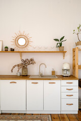 Stylish boho kitchen with wooden accents and minimalist design elements