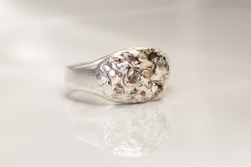 Handmade silver ring with textured surface and gemstones perfect for everyday wear and gifts.