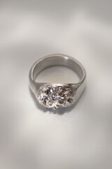 Unique silver ring with rough texture on white background. Handcraft jewelry accessories.
