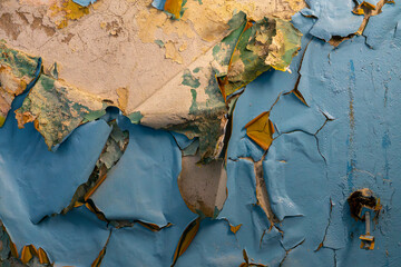 concrete texture, old wall with cracks and scratches. peeling and peeling paint on the wall of an...