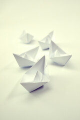 paper boats on the white background, business concept