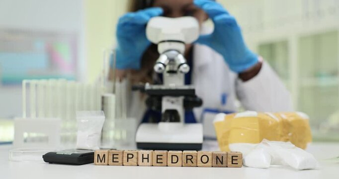 In a laboratory setting, we observe the detailed analysis of the substance mephedrone through a microscope