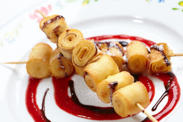 fried sweet rolls with strawberry sauce