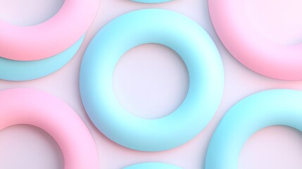 Obraz premium Colorful Pastel Rings in Soft Blue and Pink Arrangement on a Light Background for Creative Background Use