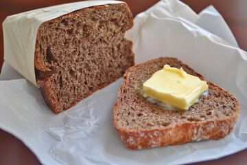 Freshly cut bread with butter ready to enjoy