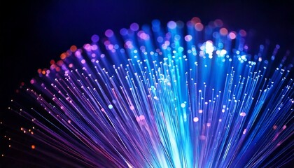 Fiber optic cable glowing in blue and purple hues, with sharp light trails and a blurred background, leaving space for text overlay