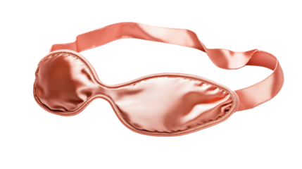 Peach-colored satin sleeping mask on transparent background for better sleep