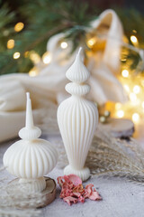 Luxurious handmade soy wax candle in cozy room, Christmas lights in the background