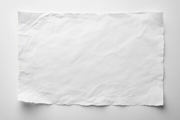 Obraz premium Crumpled white paper sheet, perfect for backgrounds, notes, or creative design projects.