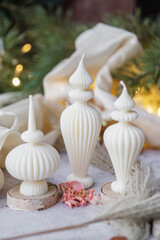 Luxurious handmade soy wax candle in cozy room, Christmas lights in the background