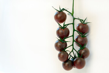 Red cherry tomatoes on a white background isolated on a white background