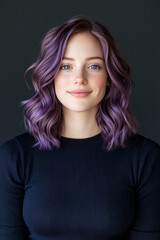 Fototapeta premium A relaxed mid-shot in a studio setting: sheâ€™s smiling slightly, letting her bright blue eyes and distinctive hair color be the centerpiece,