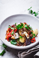 Warm quinoa salad with roasted vegetables and feta.