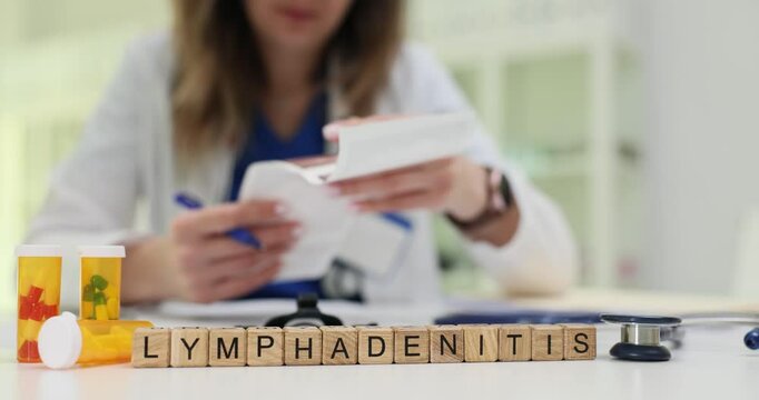 A healthcare professional is thoroughly examining vital documents related to treatment protocols for lymphadenitis