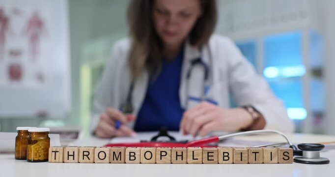 A dedicated medical professional studies thrombophlebitis with anatomical charts for accurate diagnosis and treatment