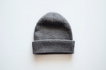 A single gray beanie positioned in the center of a white background