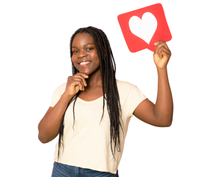 Young African girl holding romantic heart paper shape over transparent isolated background doing ok sign with fingers, excellent symbol. PNG transparent.