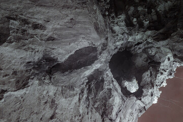 Infrared photography, a rocky cave or tunnel structure with various textures and shapes