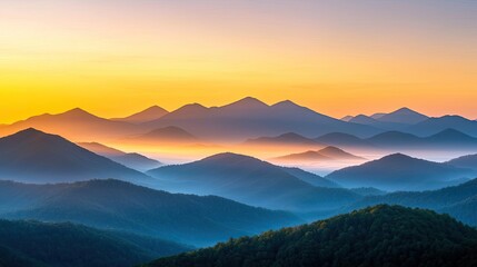 Fototapeta premium Misty mountain nature idea. Breathtaking mountain range at sunset with soft pastel colors and rolling mist.