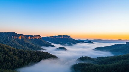 Misty mountain nature idea. Breathtaking view of mountains enveloped in mist during a stunning sunrise.