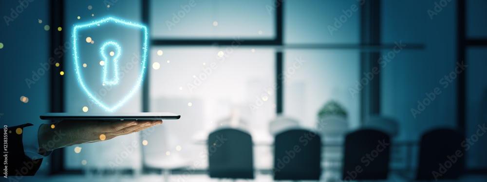 Poster Glowing shield with keyhole on tablet in hand, digital security concept in office setting.