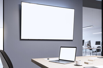 Fototapeta premium Modern conference room with blank screen and workspace setup. 3D Rendering