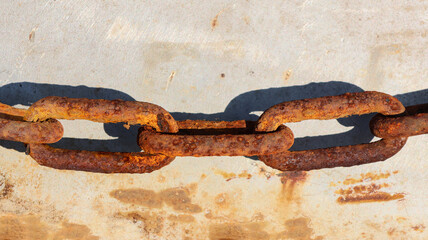 Close up shot of an old rusty chain.
