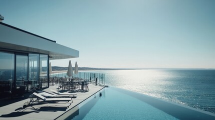 Fototapeta premium Stunning Luxury Villa with Infinity Pool Overlooking a Serene Ocean View