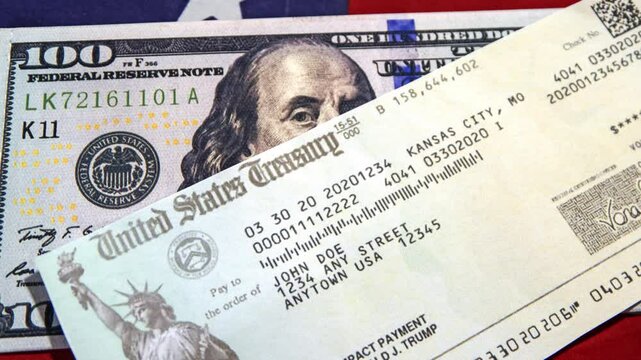 United States treasury, SSN and 100 dollars bill on the American flag, top view 4k footage