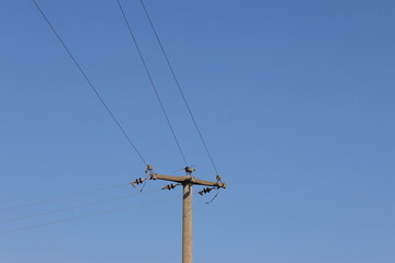 power lines against blue sky